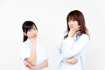 two beautiful asian doctors thinking