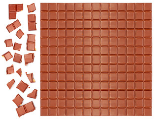 Milk chocolate bar with crushed pieces over white