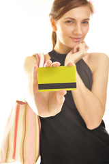 young woman holding plastic card. No cash problems