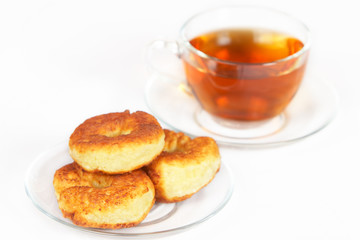 Homemade curd pancake close and a cap of tea