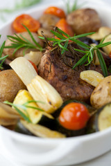 Rustic roast pork with baked vegetables and rosemary