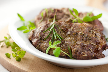 Grilled pork with herbs