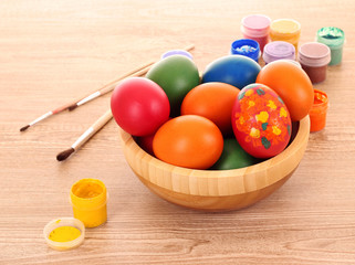 Obraz na płótnie Canvas easter eggs, color paint and brush