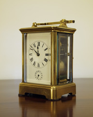 old bronze clock, minutes to twelve