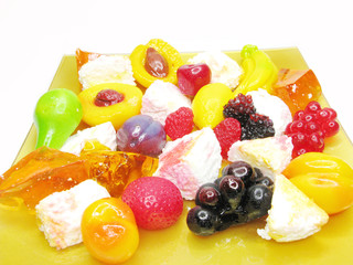 curd dessert with pudding and jelly fruits