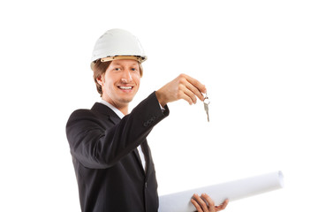 smiling engineer giving keys from apartment