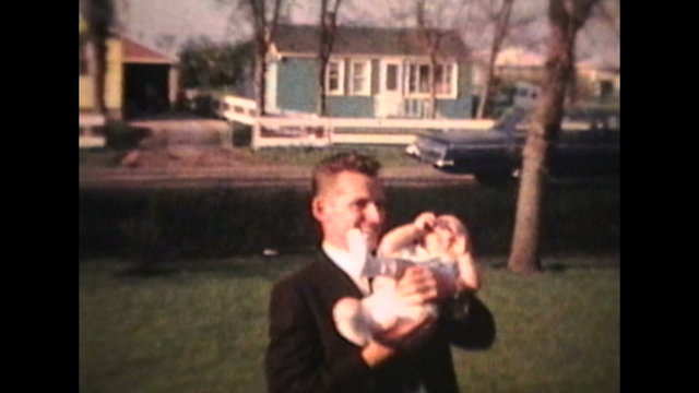 Proud Parents Holding Baby Outdoors (1963 - Vintage 8mm film)