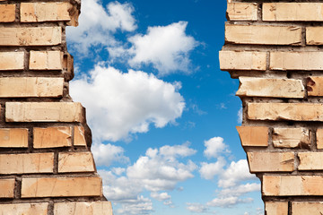 cracked brick wall to blue sky collage