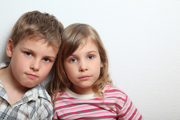 Portrait of thoughtful little girl and boy