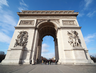 people near triumphal arch in Paris, France