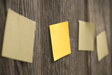 Yellow sheets on a wooden fence