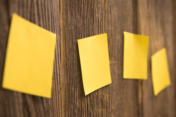 Yellow sheets on a wooden fence