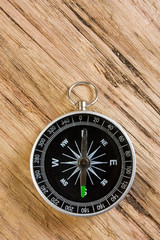 compass on the background of the wooden planks