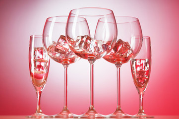 Glasses of water against gradient background
