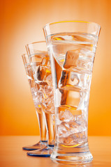 Water in the glass against gradient background