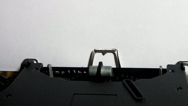 Typewriter closeup writing "http://" on white paper