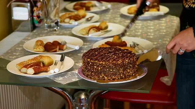 woman cuting a cake