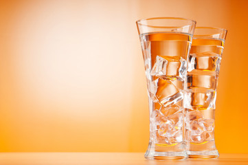 Water in the glass against gradient background
