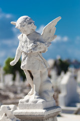 Child angel statue in a cemetery