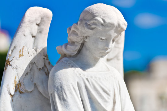 Statue of an angel with a blue sky background