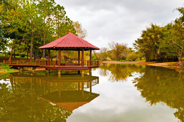 Fototapeta na wymiar Asian pavilion with reflection on a lake