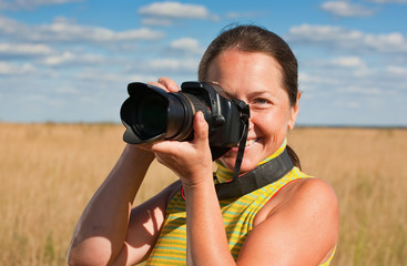 Senior woman photographer