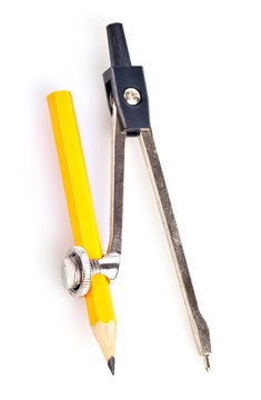 A school compass with a yellow pencil on a white background