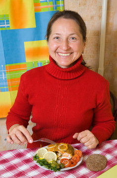 Woman Eating Stuffed Fish