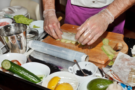 chef preparing sushi in the kitchen