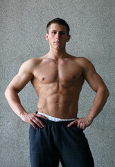 Young Muscular Man Showing His Muscles