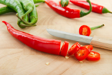 Cutting green and red peppers