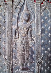 Angel statue at door in Wat Ben , Thailand