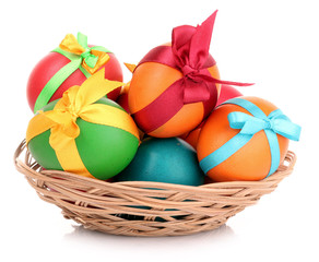 Easter eggs in basket isolated on white