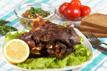 Roast leg of lamb on decorated table