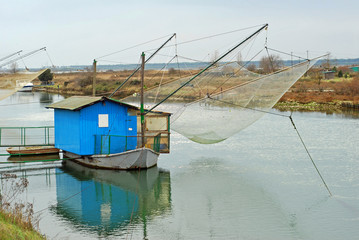 Italy Ravenna canal fishing net