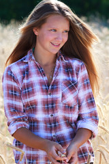 Fototapeta premium Farmer's Daughter in a Field
