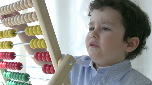 Preschool student learning  mathematics with abacus
