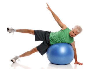 Obraz premium Mature Man Exercising With Fitness Ball