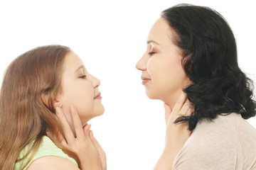 Child girl with mother hugging.