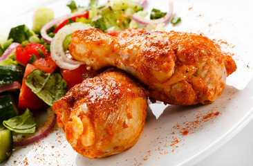 Roasted chicken drumsticks and vegetables