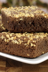 chocolate brownies with cracked peanuts on top