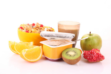 Yoghurt, muesli, milk and fruits isolated on white