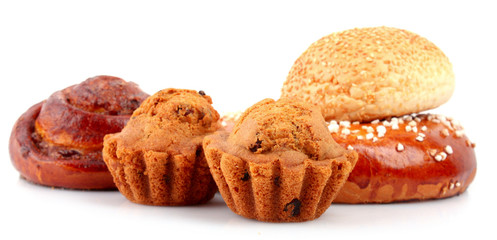 Loaf with raisins and muffin isolated on white
