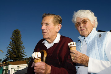 Elderly couple eating ice cream