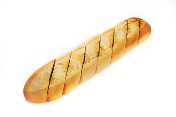 Notched loaf of bread with spices and oil isolated