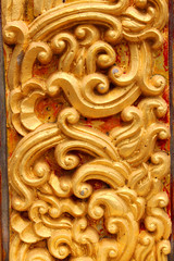 Traditional Thai style stucco texture on pillar of temple