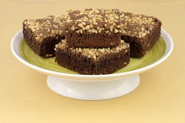 chocolate brownies with cracked peanuts on top