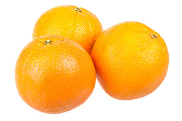 Three fresh oranges isolated on white