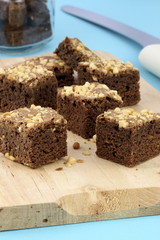 chocolate brownies with cracked peanuts on top