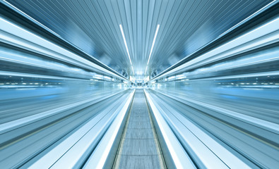 futuristic escalator inside contemporary airport © Vladitto